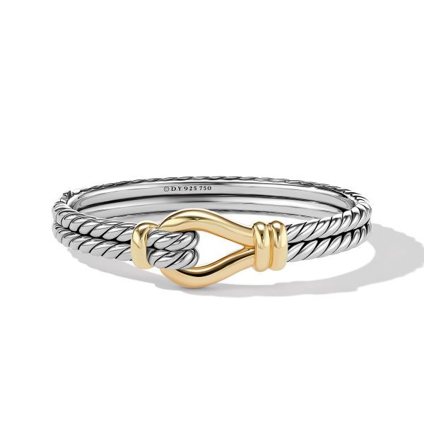 A 16MM LOOP CUFF bracelet made of twisted silver featuring a gold hook-shaped clasp. The bracelet bears an engraved designer marking, "D.Y. 925 750," and is displayed against a plain white background, creating a subtle shadow.