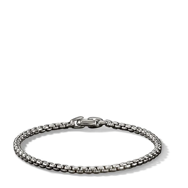 A close-up image of the 4MM BOX CHAIN BRACELET, showcasing its intricate, textured linked design and secure clasp. The silver bracelet is prominently displayed against a plain white background.