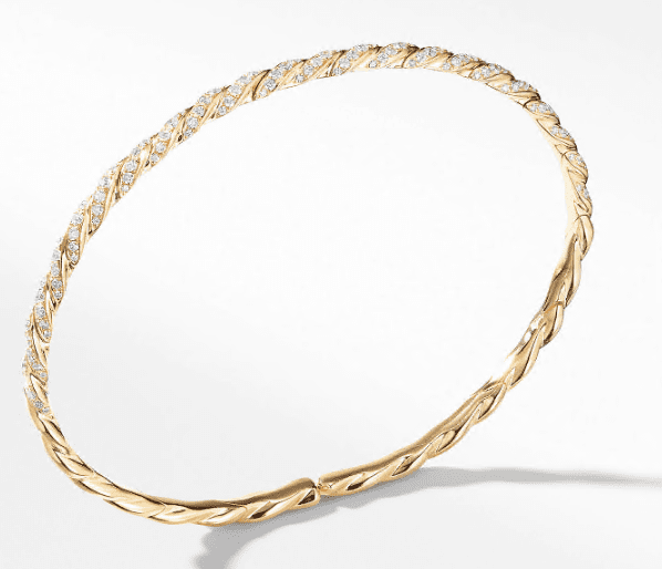 The 3.5MM PAVEFLEX BRACELET showcases a delicate twisted design with alternating smooth and textured sections. It features a simple, elegant clasp and casts a soft shadow on the white background.