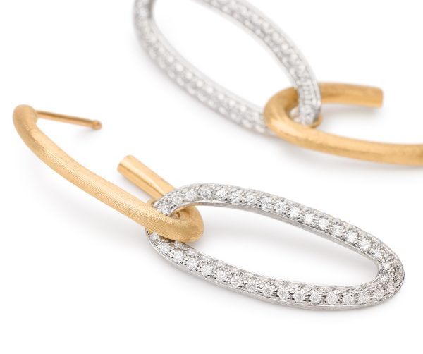 A close-up of the Marco Bicego Jaipur Diamond Drop Earrings featuring intertwined oval hoops—one with a matte gold finish and the other encrusted with small, sparkling diamonds on silver. The design is both elegant and contemporary.