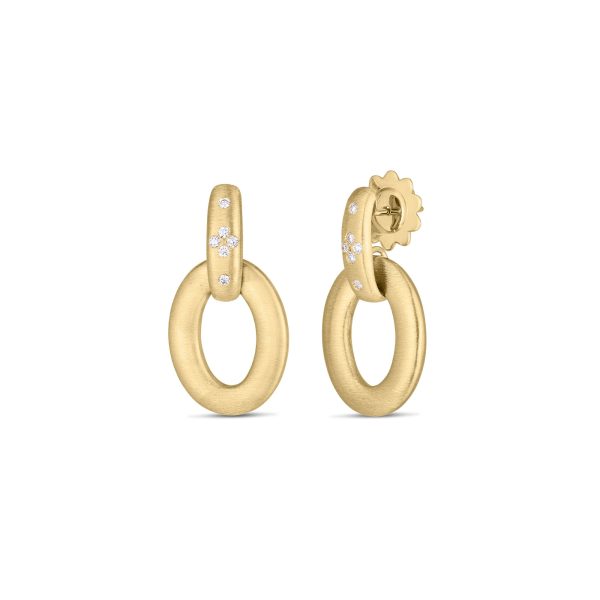 The Roberto Coin Duchessa Diamond Satin Doorknocker Earrings are crafted in gold with a matte finish. Each earring features an oval hoop dangling from a smaller oval stud adorned with small white diamonds. The stud is attached to a post-back closure, complete with a decorative flower-shaped backing.