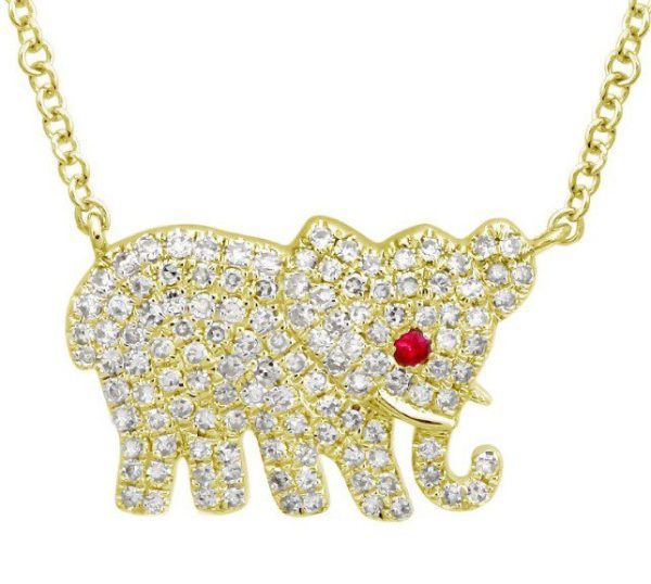 The Bromberg's Signature Collection Diamond Elephant Necklace features a stunning gold elephant pendant encrusted with numerous clear gemstones and highlighted by a striking red gem for the eye. The artistically designed elephant showcases a curled trunk and detailed accents, all suspended from a matching gold chain.