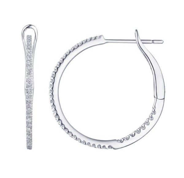 Bromberg's Signature Collection Diamond Hoop Earrings are displayed. One earring is shown from the side, highlighting the encrusted small round diamonds along its edge. The other earring is shown from the front, revealing its circular shape with the diamonds set along the outer half.