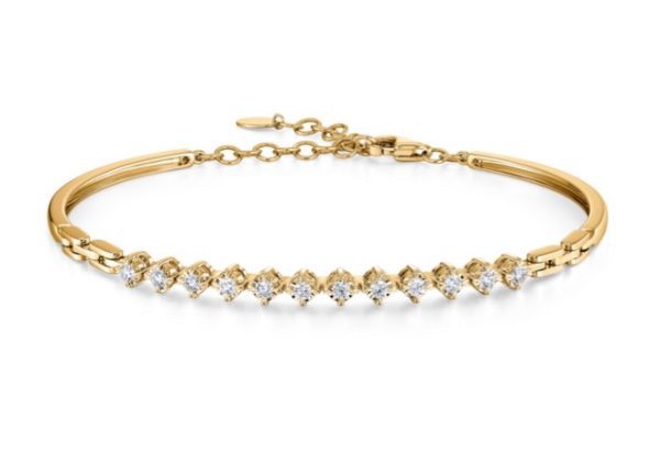 The Bromberg's Signature Collection Diamond Bangle is a gold bracelet with a chain clasp, showcasing a row of small, sparkling diamonds elegantly set in a curved design on the front. It exudes an elegant and delicate appearance.