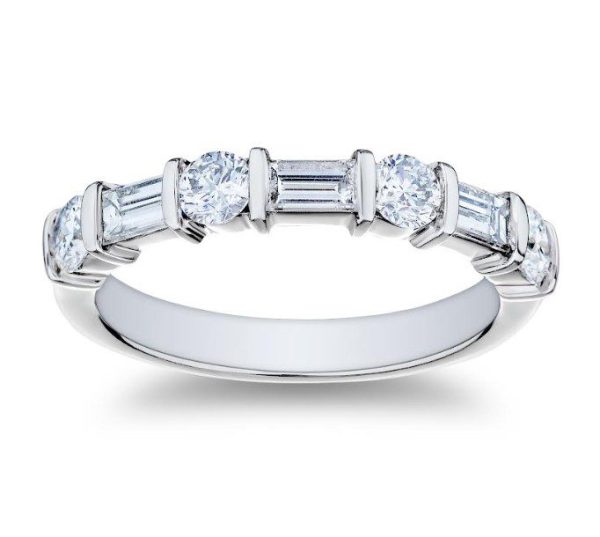 The Bromberg's Signature Collection Diamond Band features a platinum ring set with alternating round and baguette-cut diamonds, arranged in a symmetrical pattern around the band. The ring has a polished, smooth finish and showcases a modern, elegant design.