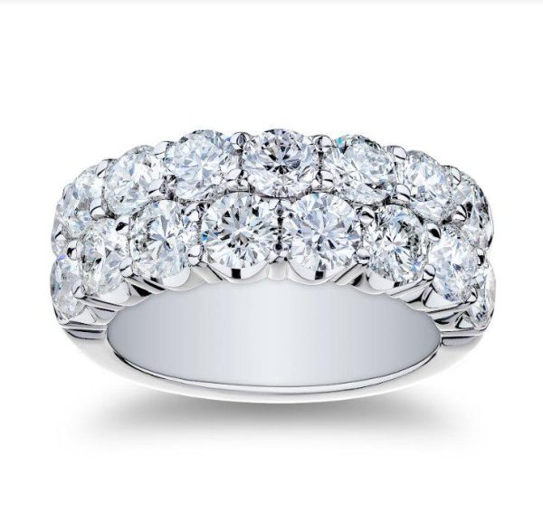 The Bromberg's Signature Collection Diamond Band features a silver band adorned with two rows of sparkling, round-cut diamonds set side by side, covering the top of the band. The prong setting enhances the brilliance of each diamond, giving the ring an elegant and luxurious appearance.