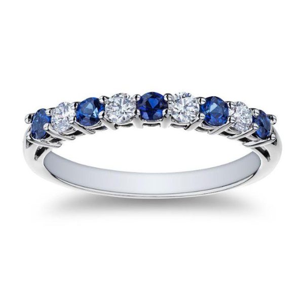 The Bromberg's Signature Collection Sapphire and Diamond Band showcases a sleek silver design, adorned with an alternating pattern of vibrant blue sapphires and sparkling white diamonds set in a row.