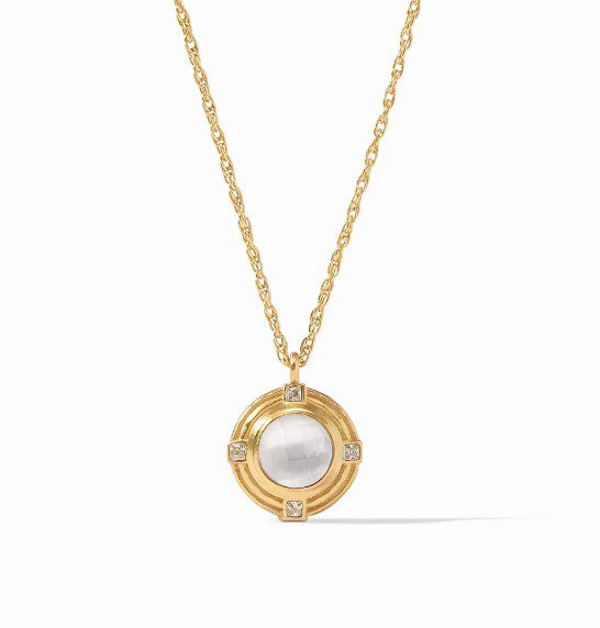 The Julie Vos Astor Solitaire Necklace is a gold chain necklace showcasing a circular pendant with a central white gemstone, framed in gold, and accented by four diamonds positioned at the cardinal points.