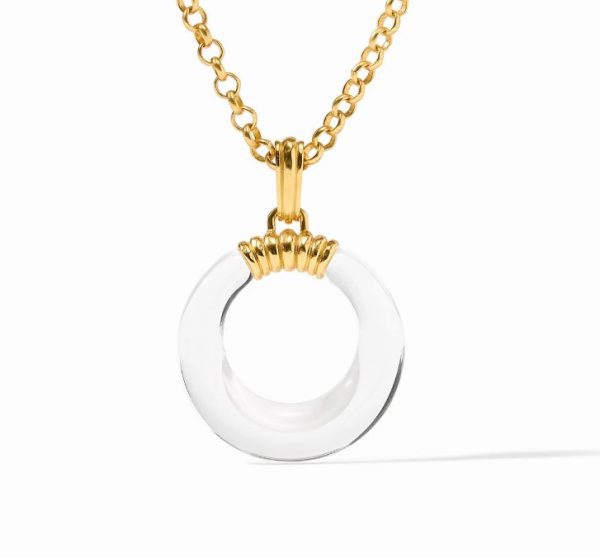 A close-up image of the Julie Vos Madison Statement Pendant Necklace, featuring a gold chain with a round pendant. The pendant showcases a smooth, circular white ring encased in gold at the top, where it connects to the chain. The necklace is artfully photographed against a plain white background.