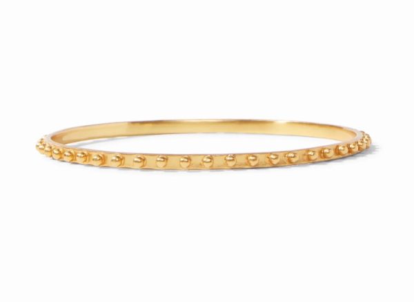 The Julie Vos SoHo Bangle Bracelet is a sleek, thin gold bangle adorned with small round bead accents along its outer edge. Set against a plain white background, this elegant bracelet's smooth finish is beautifully highlighted.