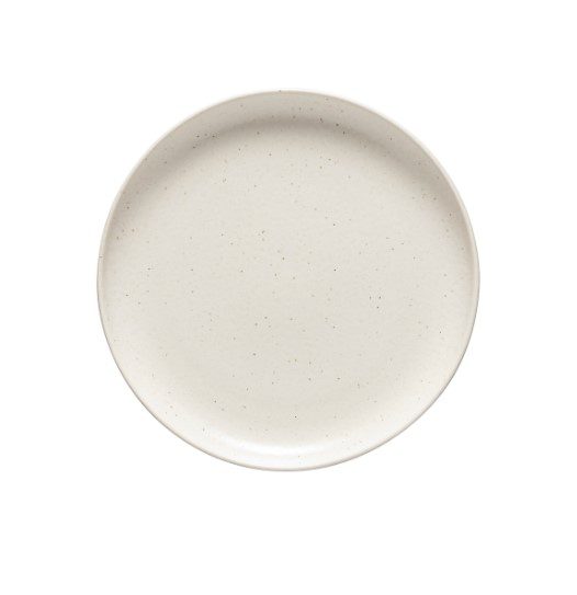 The Casafina Pacifica Salad Plate in Vanilla is a beige, round ceramic plate with a smooth surface and a subtle speckled pattern, viewed from above. It features a shallow, slightly raised rim.