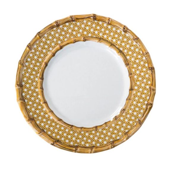 The Juliska Bamboo Caning Melamine Dessert/Salad Plate – Natural showcases a distinctive design with a white center and a broad border that mimics the intricate pattern of woven bamboo. The outer rim boasts a textured, golden-brown finish that accentuates its bamboo-like aesthetic. The plate is photographed against a white background.