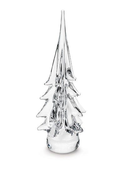 The Simon Pearce 14" Spruce Evergreen is a clear crystal glass ornament shaped like a Christmas tree. The figure is elegantly designed with smooth, elongated branches tapering upwards to a pointed top. The base is round and solid, giving a sturdy foundation to the delicate, transparent sculpture.