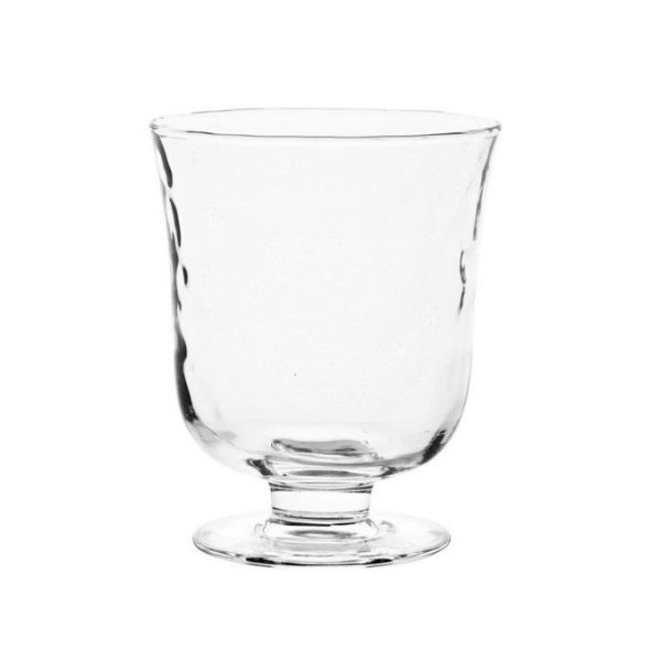 A Juliska Puro 7" Hurricane, featuring a footed base and slightly flared rim, stands gracefully centered on a white background. The elegant glass goblet boasts a smooth shape with subtle texture details.