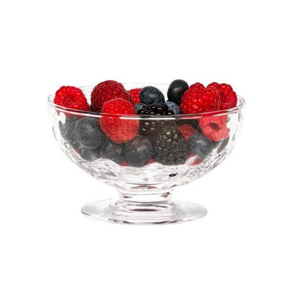 The Juliska Puro 5" Footed Bowl filled with a variety of fresh berries, including red raspberries, blackberries, and blueberries, against a white background.