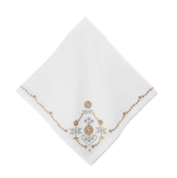 Presenting the Juliska Heidi Embroidered Napkin - Gold/Silver: a white napkin adorned with an intricate gold and silver embroidered floral design. The embroidery is concentrated on one corner, with decorative details extending along the edges of the fabric. This elegant piece is displayed on a plain white background.