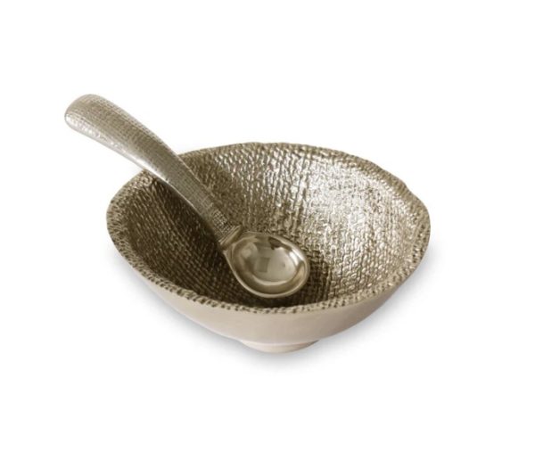 A Beatriz Ball Sierra Modern Chelsea Petit Bowl with Spoon set on a white background. The bowl features a hammered, metallic silver surface and a slightly irregular, rounded shape. The spoon's handle shares the same textured finish, complementing the design of the bowl perfectly.