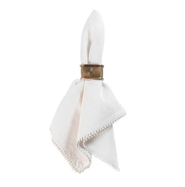 A neatly folded white cloth napkin adorned with a Juliska Blenheim Oak Napkin Ring in brass. The napkin features a sewn edge with subtle detailing and is arranged vertically, its pointed end elegantly protruding through the brass ring.