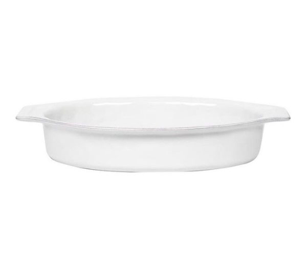 The Juliska Puro 16" Oval Baker in Whitewash, featuring slightly flared handles on each side, is displayed against a plain white background. The ceramic baking dish has a smooth, glossy surface and a shallow depth, making it perfect for baking or serving food.