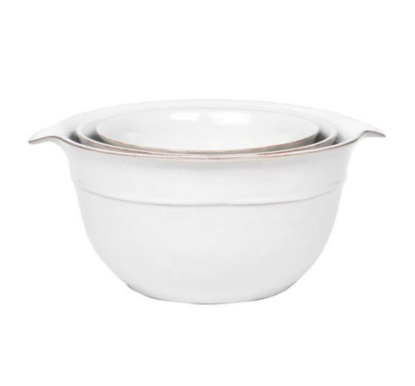 The Juliska Puro Nesting Serving Bowl Set/3pc in Whitewash consists of three ceramic mixing bowls of varying sizes that nest together. Each bowl boasts a slightly flared rim and a curved, smooth body design.