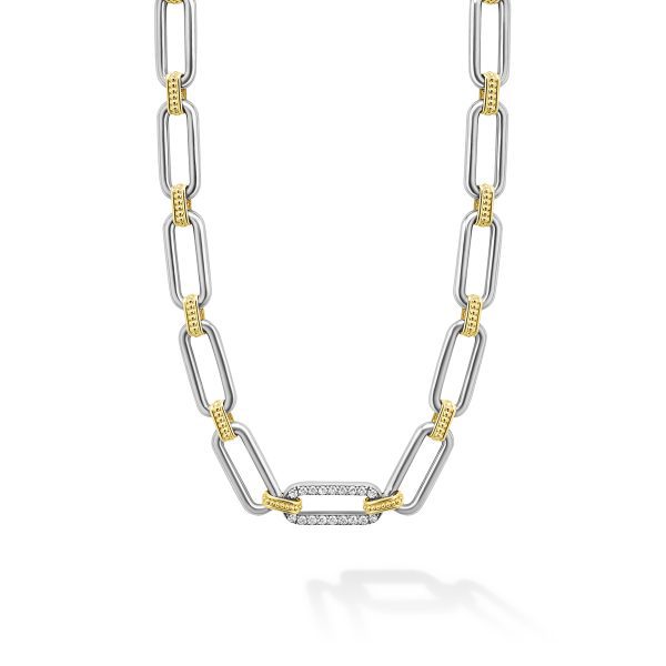 Introducing the LAGOS Signature Caviar Two-Tone Link Single Station Diamond Necklace. This sophisticated piece features large silver rectangular links interconnected with smaller gold links. The centerpiece is a single silver link encrusted with sparkling diamonds, adding an elegant touch to its minimalist design.