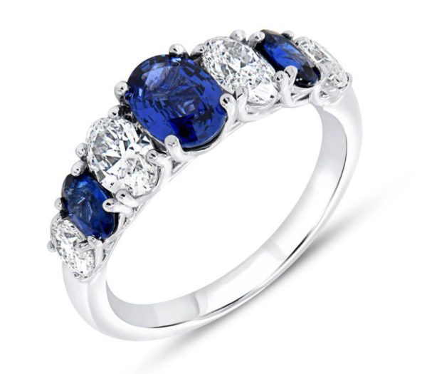 Introducing the Bromberg's Signature Collection Sapphire and Diamond Ring, a stunning piece crafted in white gold with a row of alternating oval blue sapphires and round white diamonds. This design features three radiant blue sapphires and four dazzling white diamonds set in a delicate band, beautifully accentuating the contrast between the deep blue gemstones and sparkling diamonds.