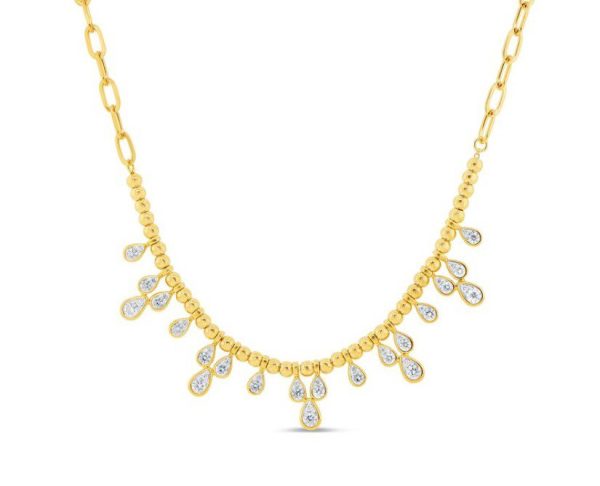 The Bromberg's Signature Collection Diamond Necklace showcases a series of linked oval-shaped chain segments in gold. The necklace is adorned with a symmetrical arrangement of gold teardrop pendants, each embedded with a shimmering clear gemstone, exuding an elegant and luxurious appearance.