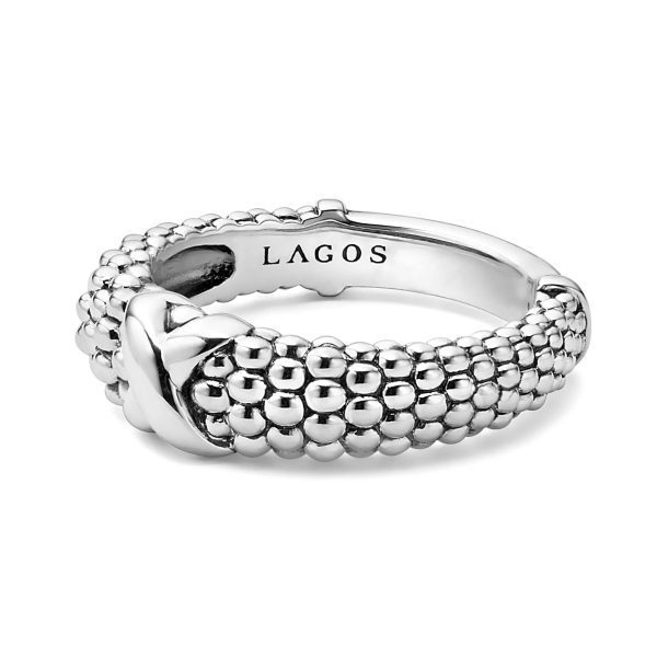 The LAGOS Embrace X Beaded Ring is a silver ring featuring a beaded design with a bow-shaped accent and the brand name "LAGOS" engraved inside the band.