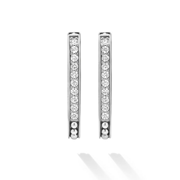 Introducing the LAGOS Caviar Spark Linear Diamond Hoop Earrings, a stunning pair of silver hoops delicately adorned with small, sparkling round diamonds arranged in a vertical line. Captured against a white background with subtle shadows beneath them, these earrings exude elegance and sophistication.