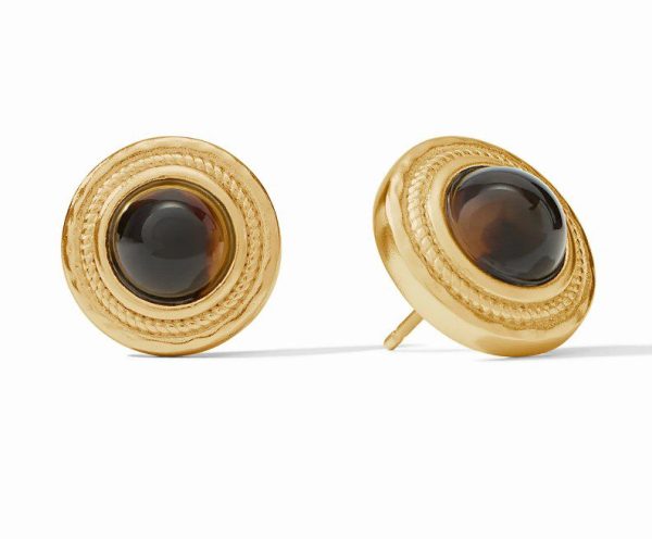 The Julie Vos Madison Stud Earrings are a pair of round, gold-tone stud earrings featuring central black stones. They have a detailed border pattern around the stones, giving them a vintage-inspired look.