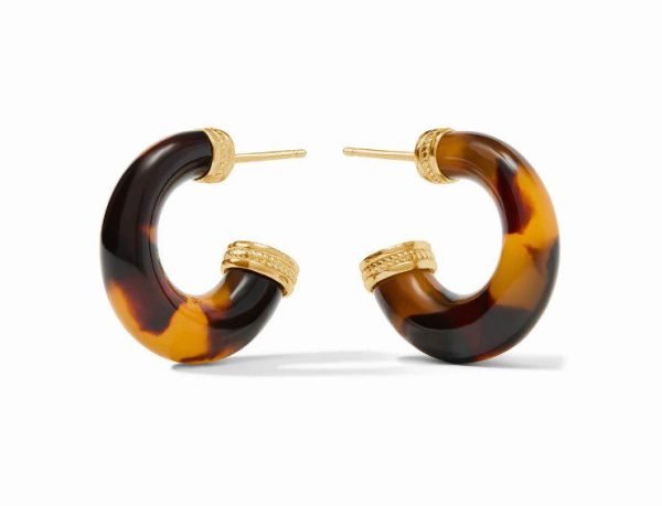 The Julie Vos Small Madison Statement Hoop Earrings feature a chunky, half-circle design crafted from tortoiseshell-patterned resin in marbled shades of dark brown and amber, complemented by textured gold-tone metal accents positioned at the top.