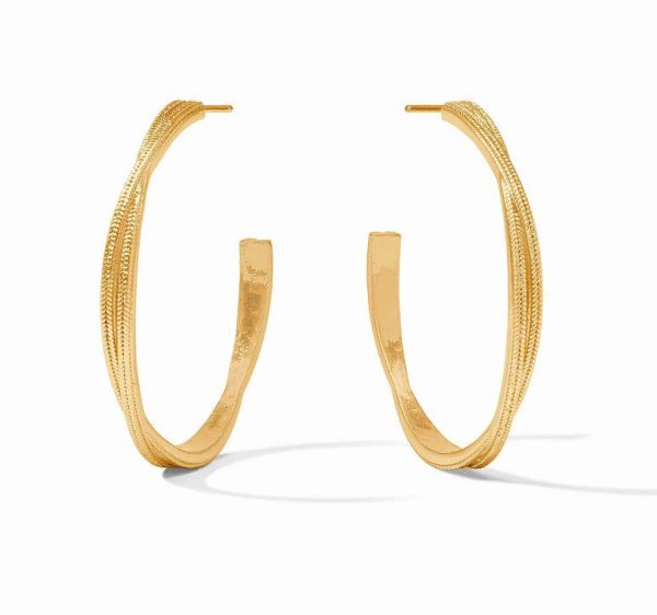 The Julie Vos Large Cheval Twist Hoop Earrings feature a pair of large gold hoops with a slightly twisted, textured design. These open-ended hoops have flat ends and are displayed standing upright against a white background, with shadows visible beneath each earring.