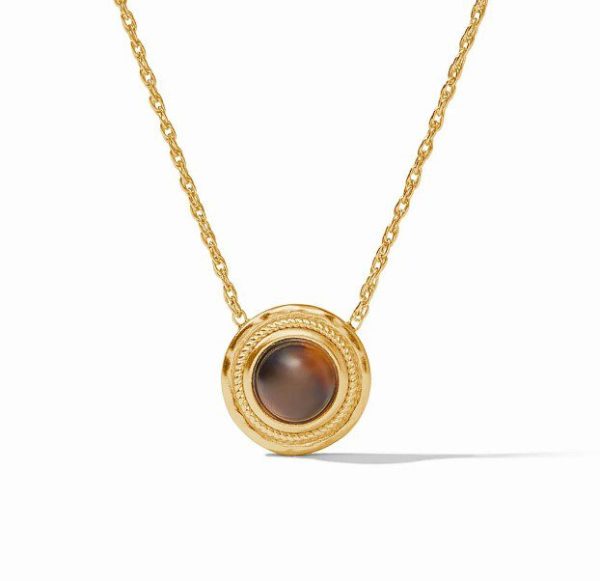 The Julie Vos Madison Delicate Necklace features a gold round pendant with a dark brown gemstone at the center. The pendant is adorned with a textured rim and is suspended from a delicate gold chain, displayed against a plain white background.