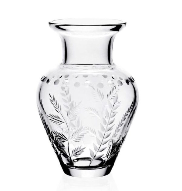 The William Yeoward Fern Bouquet Vase - 6.5" is a clear glass vase intricately etched with delicate botanical patterns of leaves and small dots. It features a wide, flared rim, giving it an elegant and ornate appearance, and is set against a plain white background.