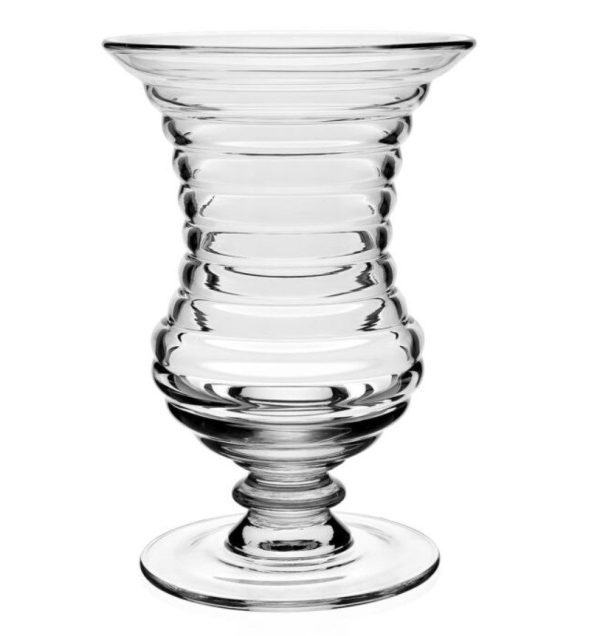 The William Yeoward Ripples Footed Vase - 11" is a clear glass vase with a wide, flared opening and a round, broad base. It features multiple horizontal ridges along its body, giving it a textured, ribbed appearance.