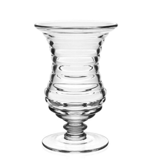 The William Yeoward Ripples Footed Vase - 8.5" showcases a clear, fluted glass design with a wide rim and a rounded base. It features a ribbed spiral pattern along its body and is displayed empty against a plain white background.