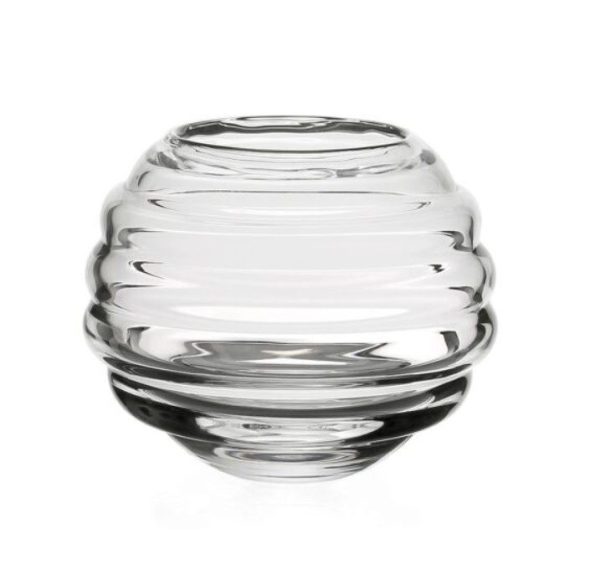 The William Yeoward Ripples Rose Bowl, a clear, round glass vase with a ribbed design, is centered against a plain, white background. Featuring horizontal, evenly spaced ridges that create a textured appearance, the bowl has a wide opening at the top.