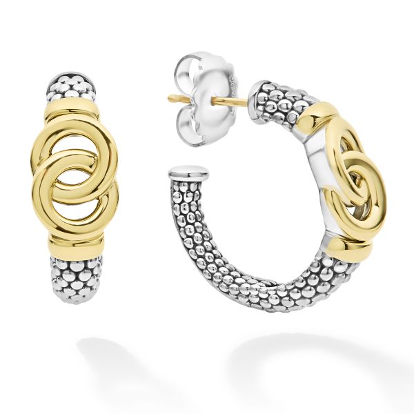 The LAGOS Signature Caviar Two-Tone Interlocking Hoop Earrings feature a stylish design with interlocking gold-colored rings at the center and a semicircle band adorned with a textured silver and darker bead-like pattern. One earring is displayed from the front, while the other is shown from the side.