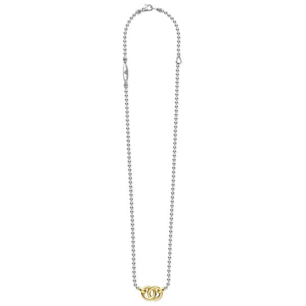 The LAGOS Signature Caviar Two-Tone Interlocking Pendant Necklace is a silver chain necklace with round links, featuring a small, intertwined "GG" logo pendant in gold at the center. The clasp and extension chain are visible at the top. The overall design is elegant and minimalist.