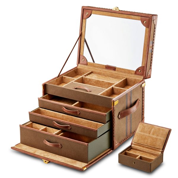 The Wolf 1834 Ida Trunk Jewellery Box is an open, multi-layered organizer with diverse compartments and drawers, complete with a mirror on the inside of the lid. The exterior is meticulously crafted from brown leather and canvas, highlighting exquisite stitching and detailing.