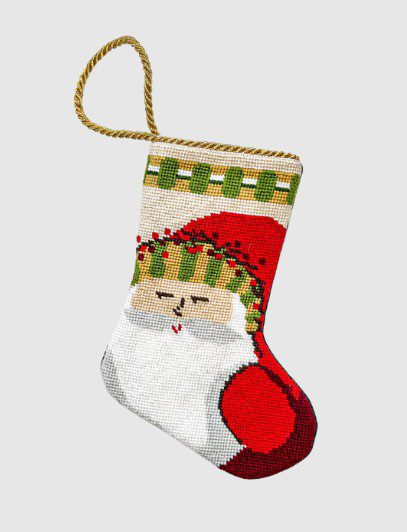 Introducing the Baubles Stockings + Vietri Old St. Nick in Stripes: a festive Christmas stocking showcasing a needlepoint design featuring Santa Claus adorned in striped attire. This exquisite stocking includes a gold braided loop for easy hanging, depicting Santa’s face along with his signature red hat.