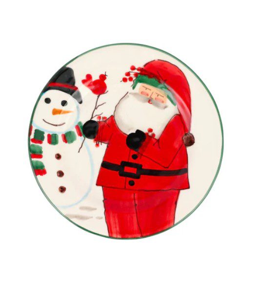 The Vietri Old St. Nick 2024 Limited Edition Salad Plate displays an artistic image of Santa Claus with a cardinal, alongside a joyful snowman who is adorned in a black hat and green-striped scarf, all encased within a circular green border.