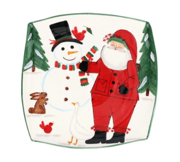 The Vietri Old St. Nick 2024 Limited Edition Square Platter showcases Santa Claus in a red suit and hat beside a snowman wearing a top hat and scarf, while nearby, a rabbit and a goose are surrounded by pine trees and cardinals against a snowy background.