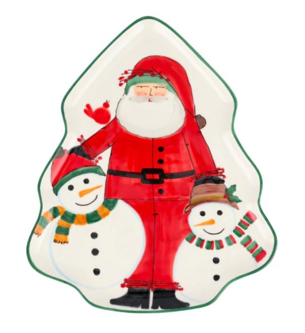 The Vietri Old St. Nick 2024 Limited Edition Figural Tree Platter is a ceramic plate designed in the shape of a Christmas tree, showcasing a painted scene of Santa Claus accompanied by two snowmen, each adorned with colorful scarves and hats. A small red bird perches on Santa's arm, while the platter is elegantly finished with green edges.