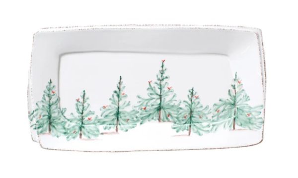 Vietri Melamine Lastra Holiday Rectangular Platter, showcasing a hand-painted design of green pine trees with subtle red accents on a plain backdrop, and bordered by a gently textured edge that adds a rustic appeal.