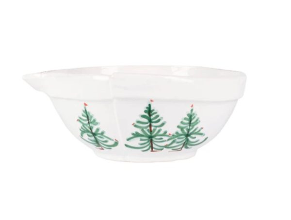 Vietri Lastra Holiday Medium Mixing Bowl is a white ceramic mixing bowl with a spout, adorned with a printed pattern of green Christmas trees and small red dots on a white background.