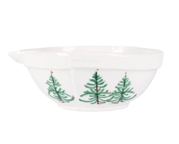 The Vietri Lastra Holiday Large Mixing Bowl is a white ceramic mixing bowl with a pouring spout, featuring a festive design of green pine trees adorned with small red accents.