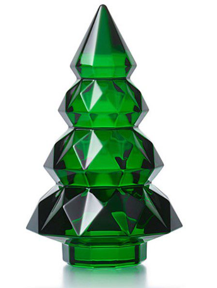 A geometric Baccarat 2024 Louxor 5" Tree in green, crafted from glass and resembling a stylized Christmas tree with shiny, faceted surfaces. It features three ascending tiers of decreasing size, crowned with a pointed tip, set against a plain background.