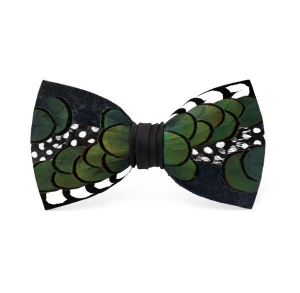 The Brackish Bow Tie - Bondurant showcases a pattern of green scales adorned with black and white polka dot feathers, while the center is wrapped in black fabric for a bold, stylish appearance.