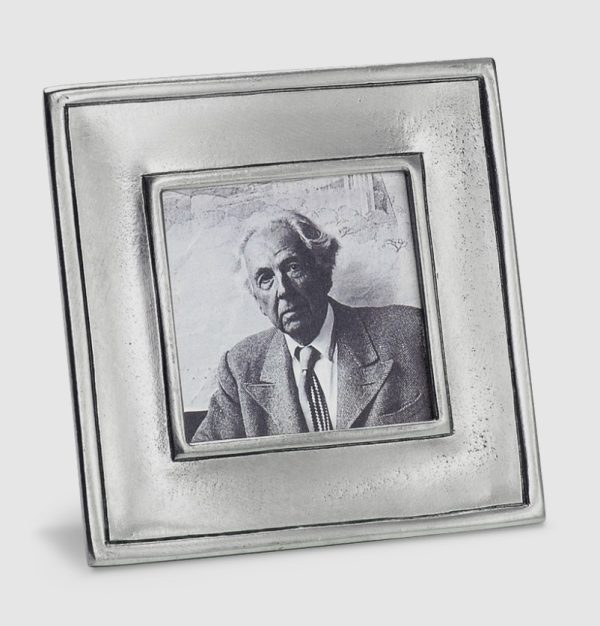 The older man in a suit and tie is showcased in the MATCH Lombardia Frame, which features a square, metallic design. The black and white photo captures him seated from the shoulders up against a blurred backdrop.